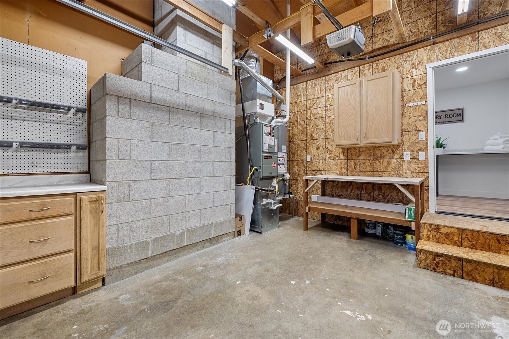 9218 Northeast 184th Place Bothell, WA 98011 - Photo 35 of 37 a view of a room with racks on the wall