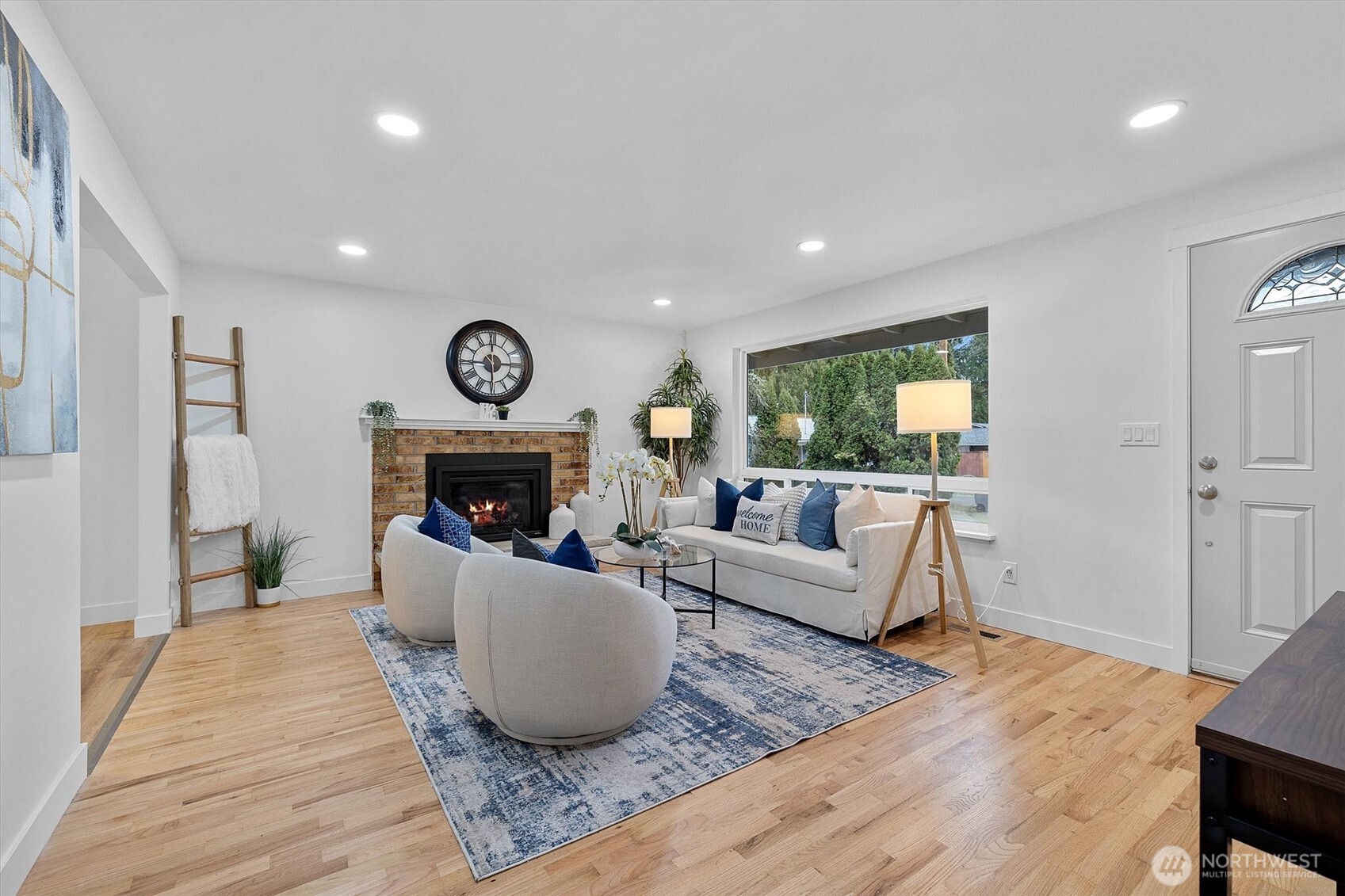 9218 Northeast 184th Place Bothell, WA 98011 - Photo 4 of 37 a living room with furniture and a fireplace