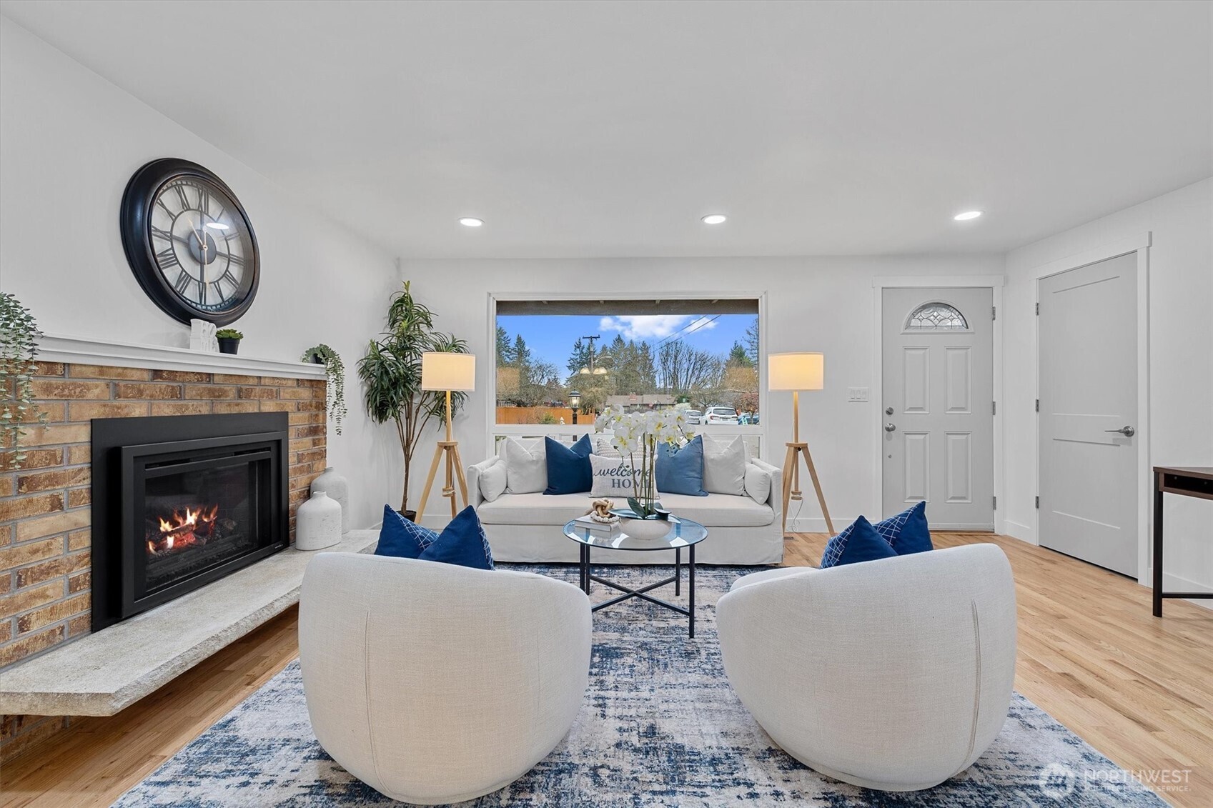 9218 Northeast 184th Place Bothell, WA 98011 - Photo 5 of 37 a living room with furniture and a fireplace