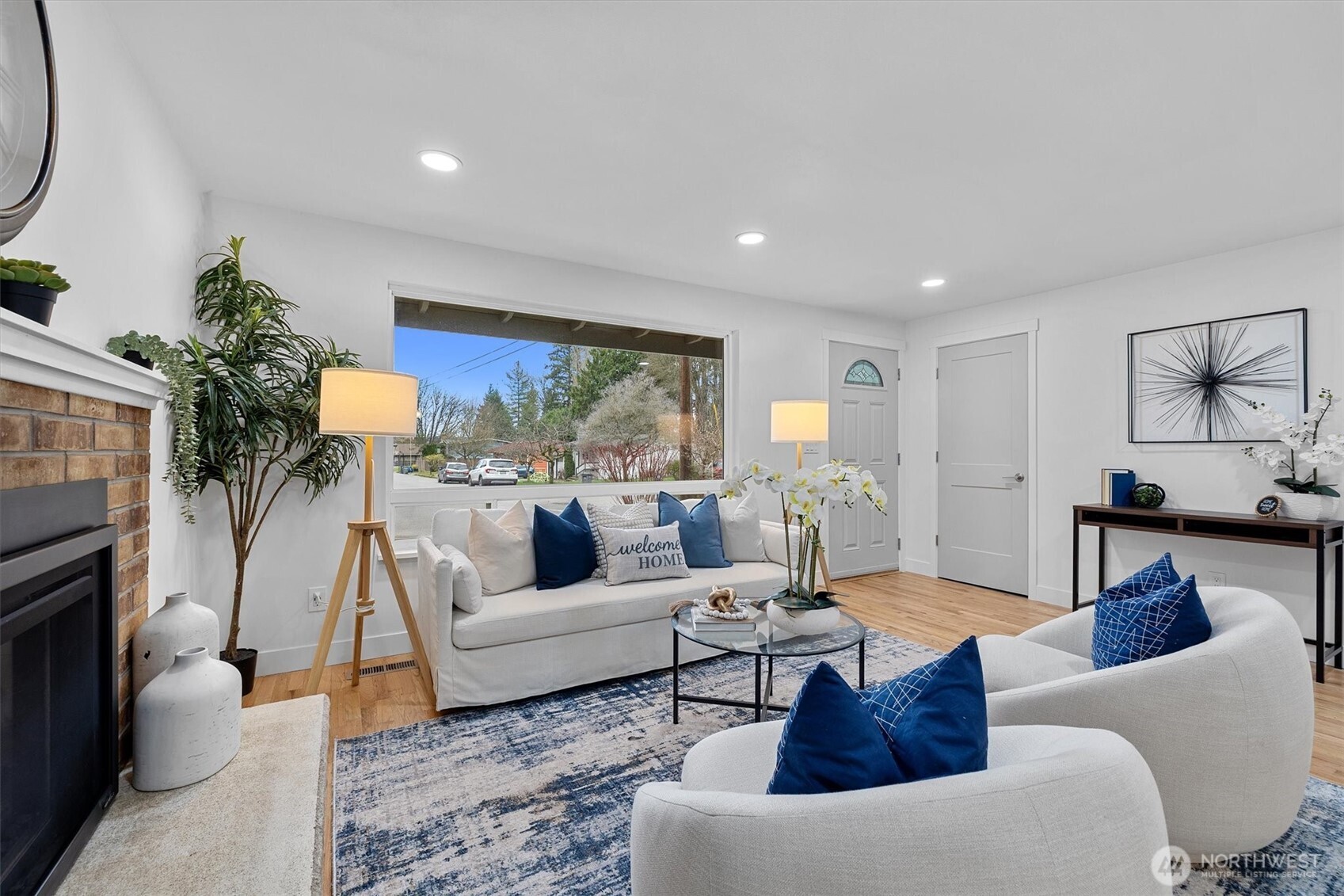 9218 Northeast 184th Place Bothell, WA 98011 - Photo 6 of 37 a living room with furniture and a large window