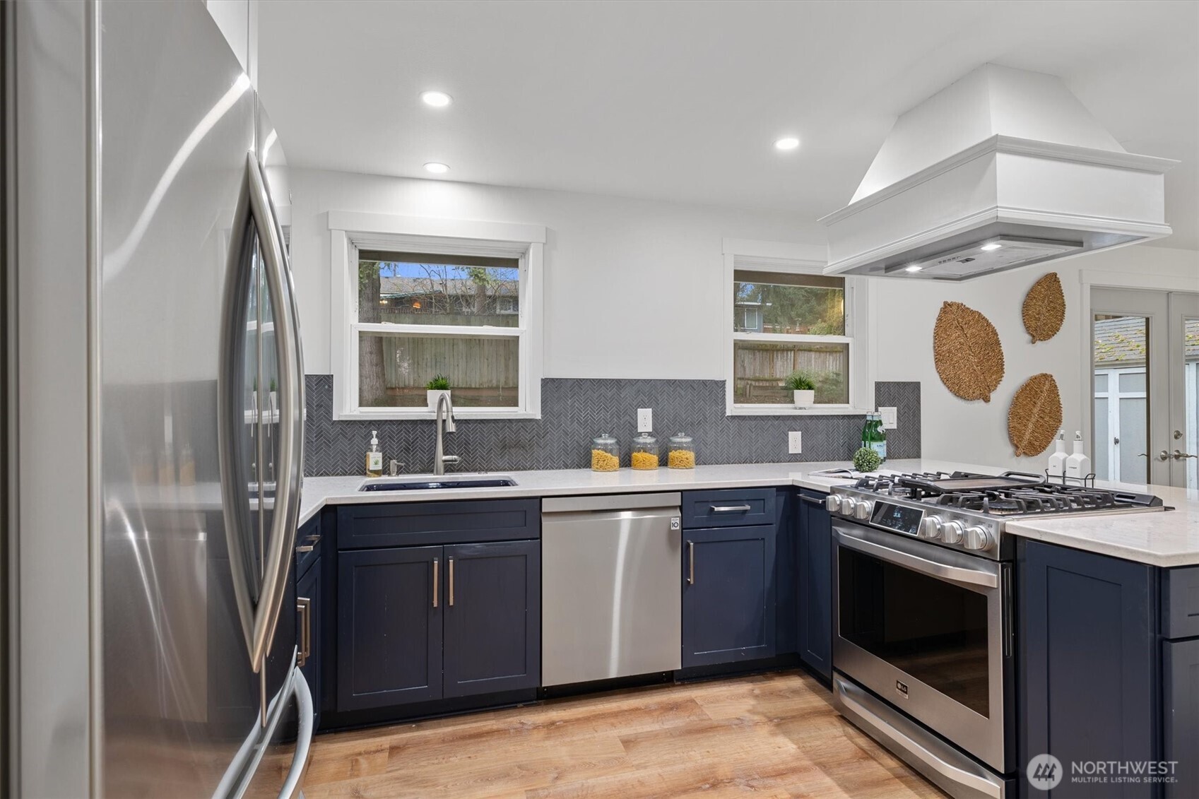 9218 Northeast 184th Place Bothell, WA 98011 - Photo 8 of 37 a kitchen with stainless steel appliances granite countertop a stove and a sink