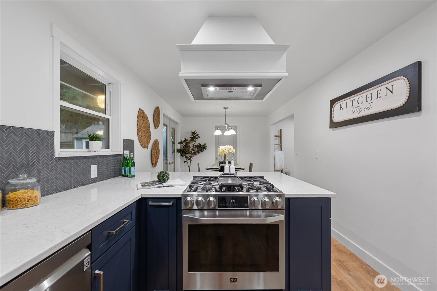 9218 Northeast 184th Place Bothell, WA 98011 - Photo 10 of 37 a kitchen with a stove and a sink