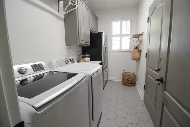 a utility room with dryer and washer