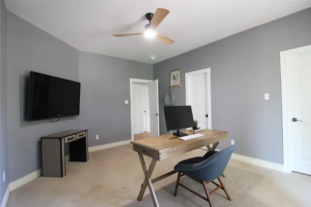 a view of a livingroom with furniture and a flat screen tv
