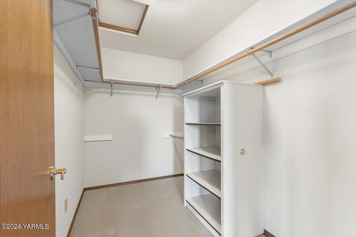 11810 West Barrett Road Yakima, WA 98908 - Photo 23 of 47 a view of walk in closet with empty racks