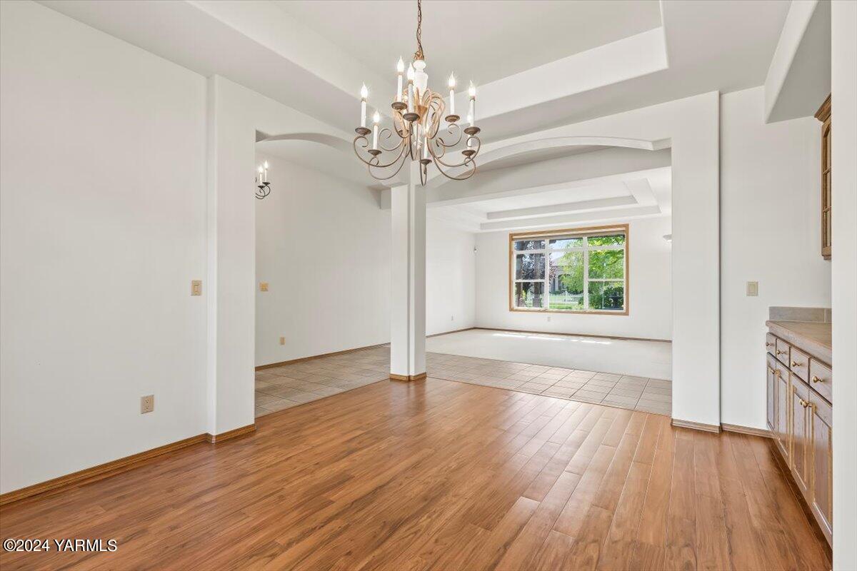 11810 West Barrett Road Yakima, WA 98908 - Photo 24 of 47 a view of an empty room with wooden floor and a window