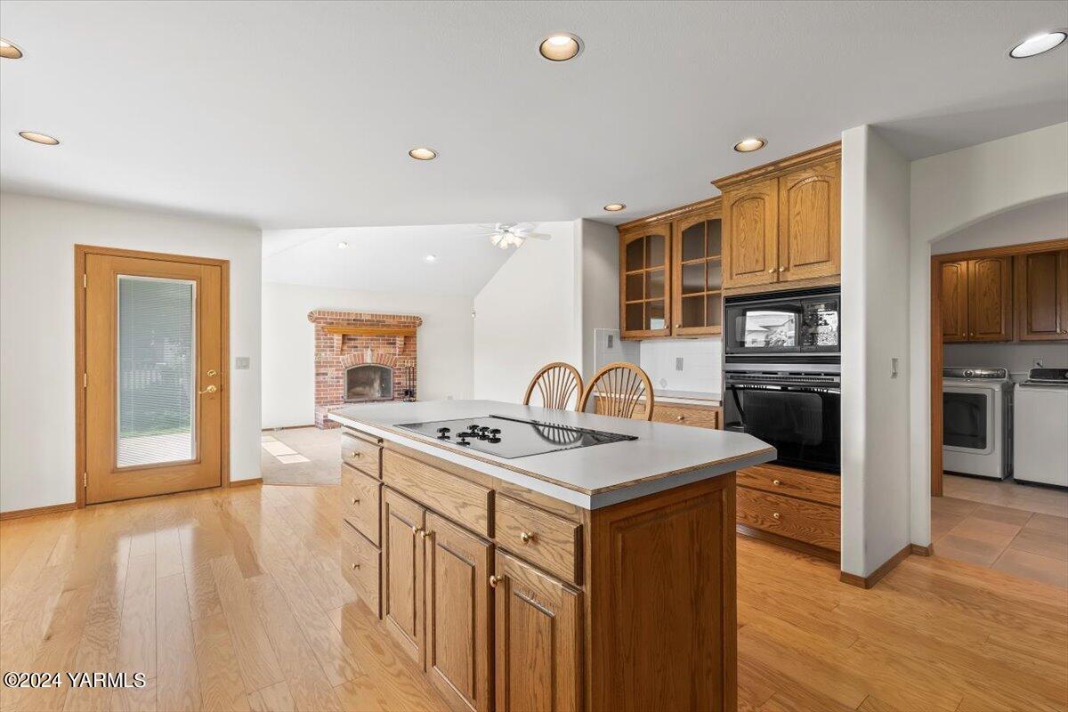 11810 West Barrett Road Yakima, WA 98908 - Photo 27 of 47 a kitchen with stainless steel appliances granite countertop a stove top oven a sink and a refrigerator