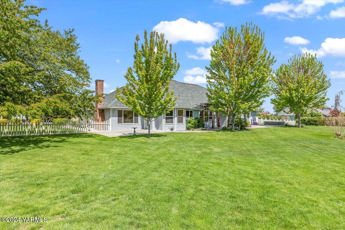 11810 West Barrett Road Yakima, WA 98908 - Photo 36 of 47 a view of house with garden space and trees