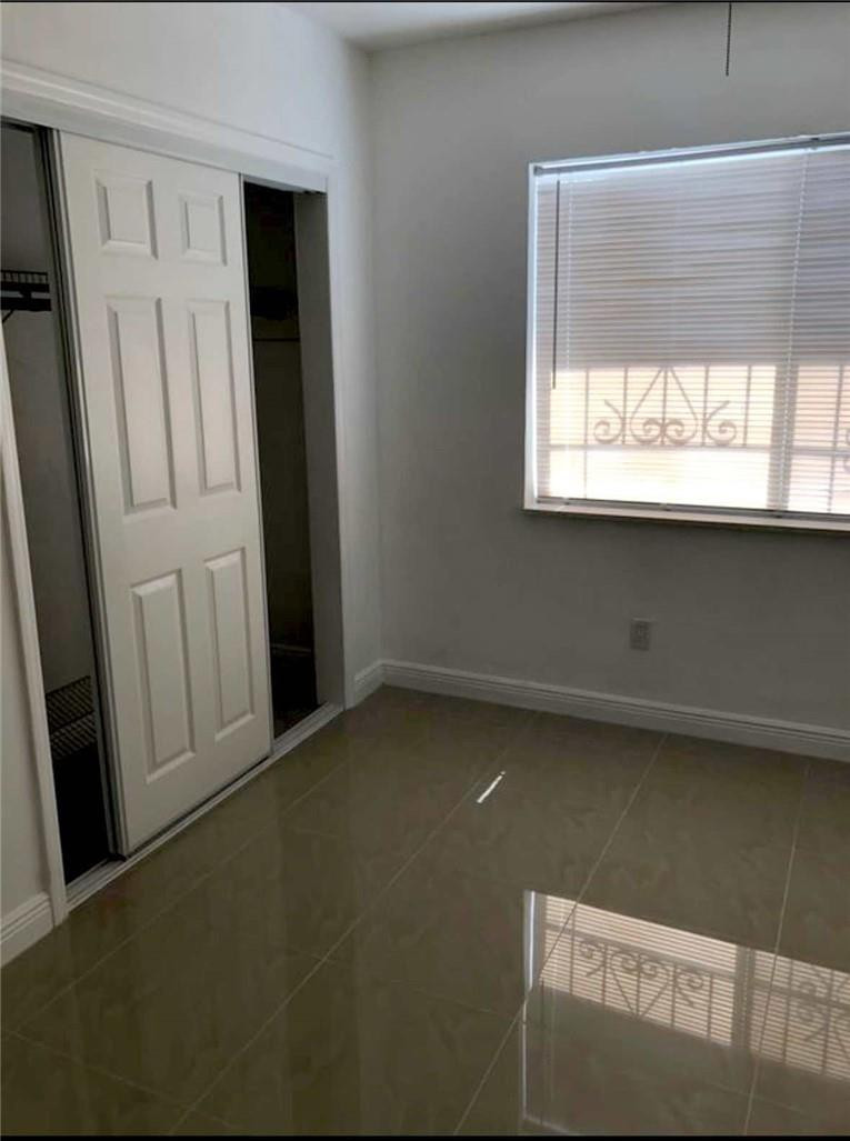 540 Beacom Boulevard Miami, FL 33135 - Photo 13 of 27 a view of a livingroom with a window