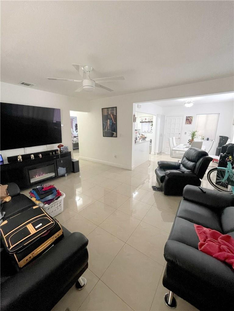 540 Beacom Boulevard Miami, FL 33135 - Photo 18 of 27 a living room with furniture and a flat screen tv