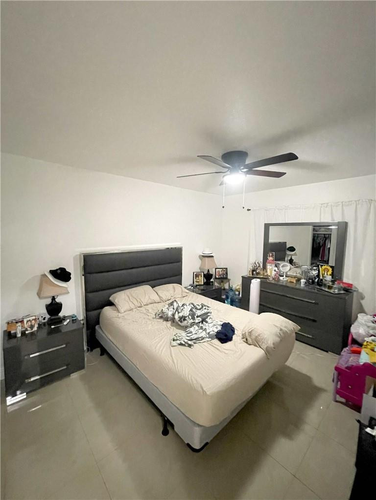 540 Beacom Boulevard Miami, FL 33135 - Photo 21 of 27 a bedroom with a bed and a couch