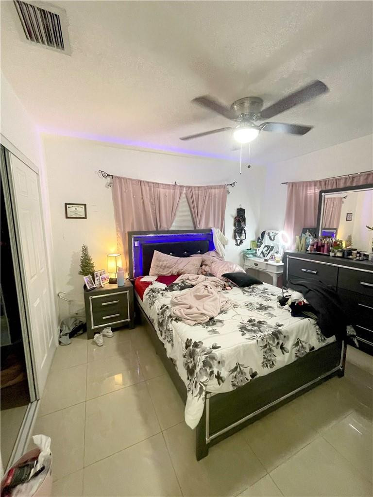 540 Beacom Boulevard Miami, FL 33135 - Photo 22 of 27 a bed sitting in a bedroom next to a window