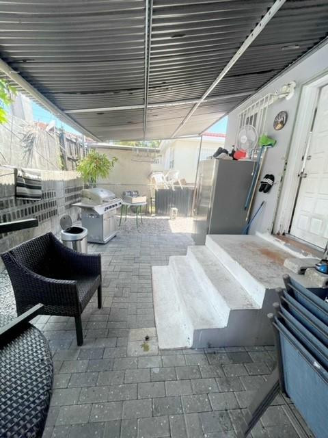 540 Beacom Boulevard Miami, FL 33135 - Photo 23 of 27 a view of a chairs and table in a patio