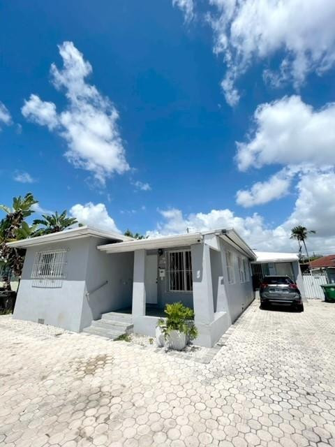 540 Beacom Boulevard Miami, FL 33135 - Photo 4 of 27 a view of a house with a patio