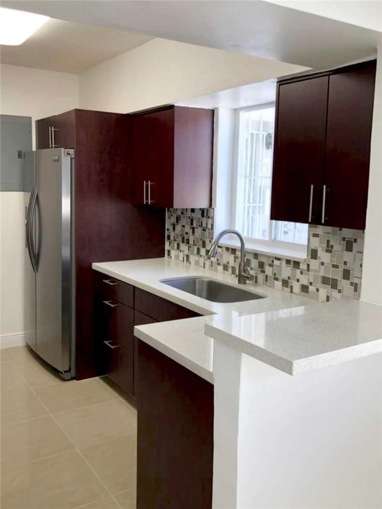 540 Beacom Boulevard Miami, FL 33135 - Photo 5 of 27 a bathroom with a sink and a mirror