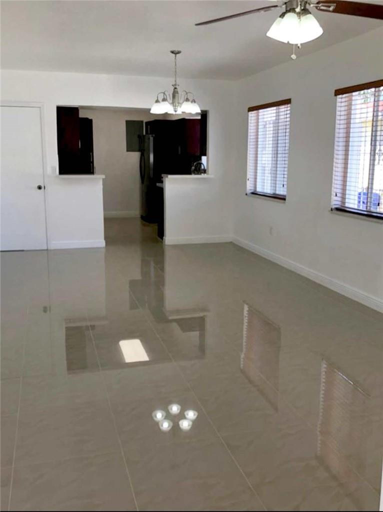540 Beacom Boulevard Miami, FL 33135 - Photo 7 of 27 a view of kitchen with furniture and flat screen tv