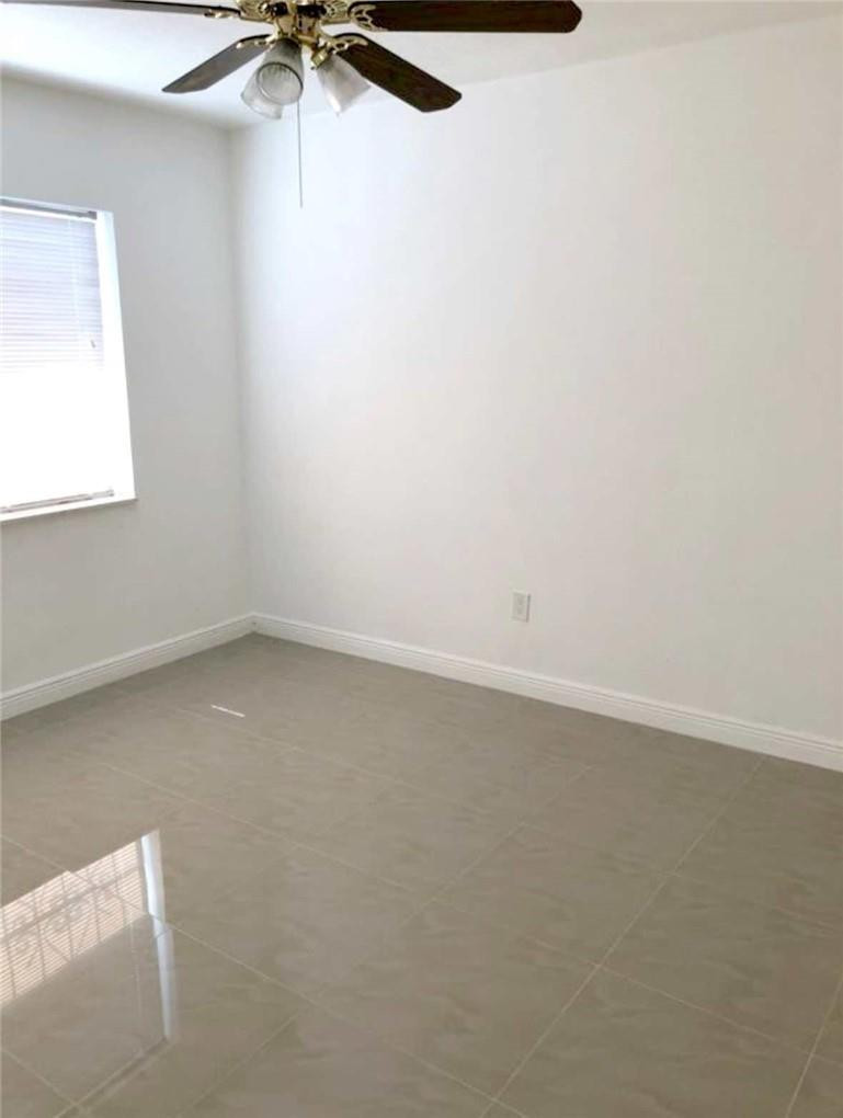 540 Beacom Boulevard Miami, FL 33135 - Photo 9 of 27 an empty room with a window