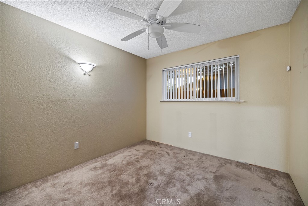 16464 Tullock Street Fontana, CA 92335 - Photo 20 of 43 a view of an empty room with a window