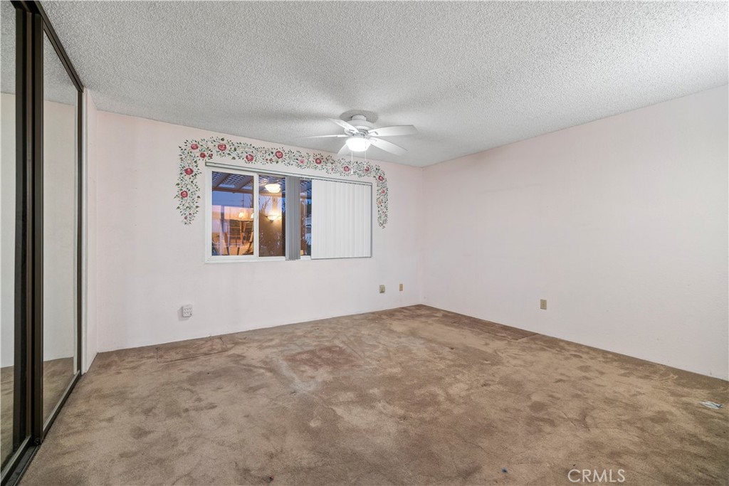 16464 Tullock Street Fontana, CA 92335 - Photo 26 of 43 a view of an empty room with a window