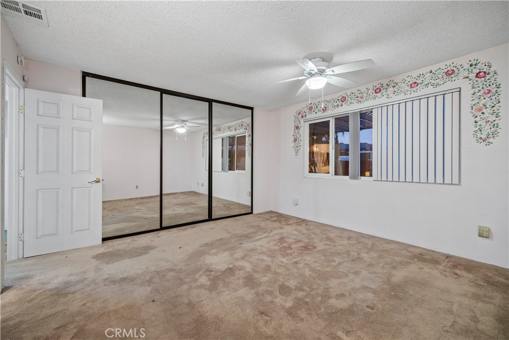 16464 Tullock Street Fontana, CA 92335 - Photo 27 of 43 a view of an empty room with a window