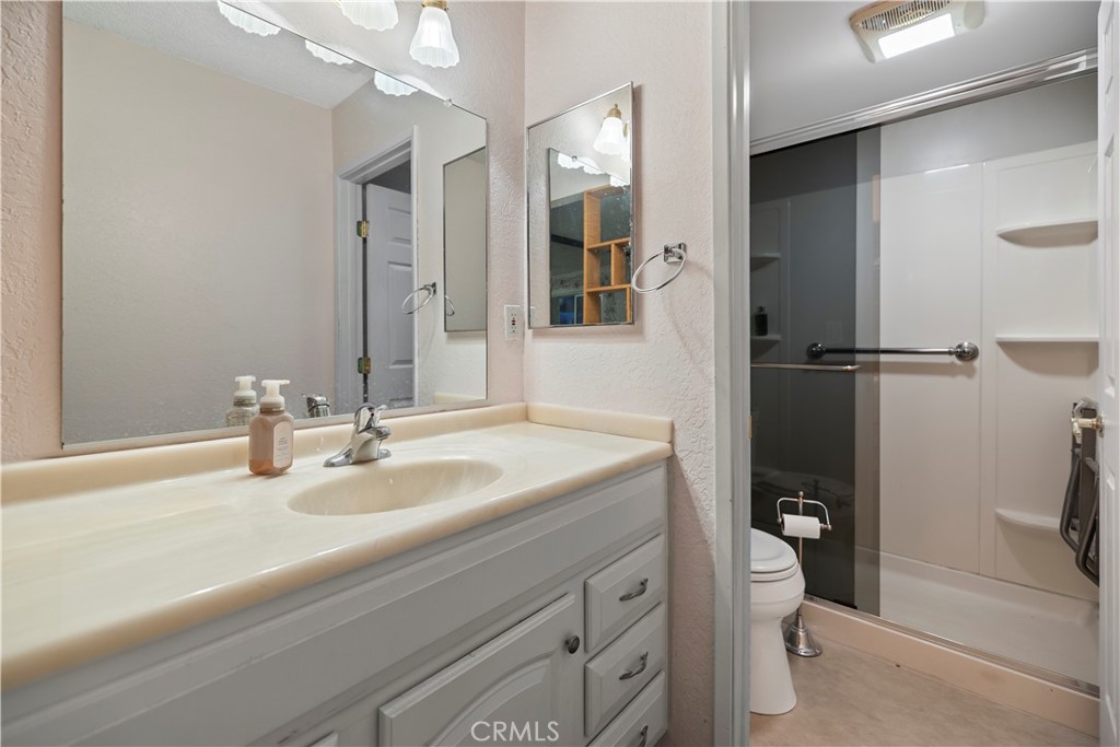 16464 Tullock Street Fontana, CA 92335 - Photo 29 of 43 a bathroom with a sink toilet and shower