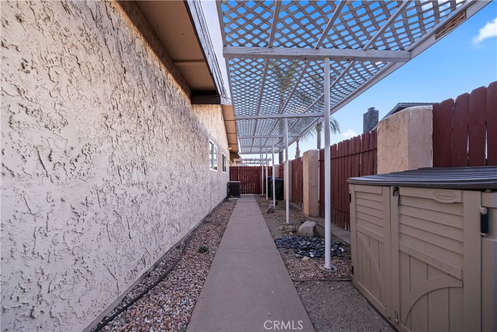 16464 Tullock Street Fontana, CA 92335 - Photo 34 of 43 a view of a pathway of a building