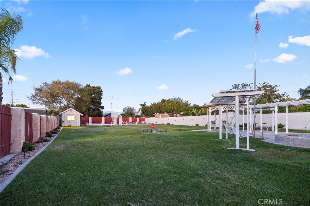 16464 Tullock Street Fontana, CA 92335 - Photo 35 of 43 a view of a house with a yard and sitting area