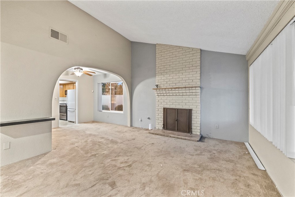 16464 Tullock Street Fontana, CA 92335 - Photo 4 of 43 an empty room with windows