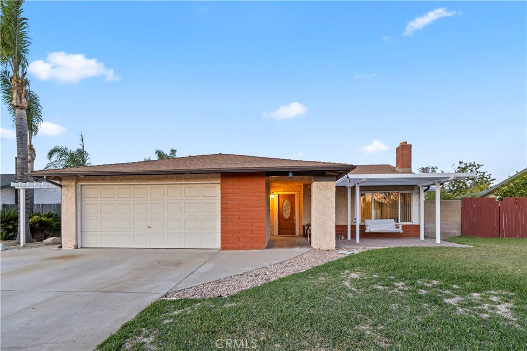 16464 Tullock Street Fontana, CA 92335 - Photo 42 of 43 a front view of house with yard