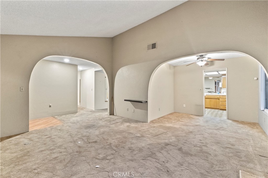 16464 Tullock Street Fontana, CA 92335 - Photo 5 of 43 a view of a big room with closet and mirror