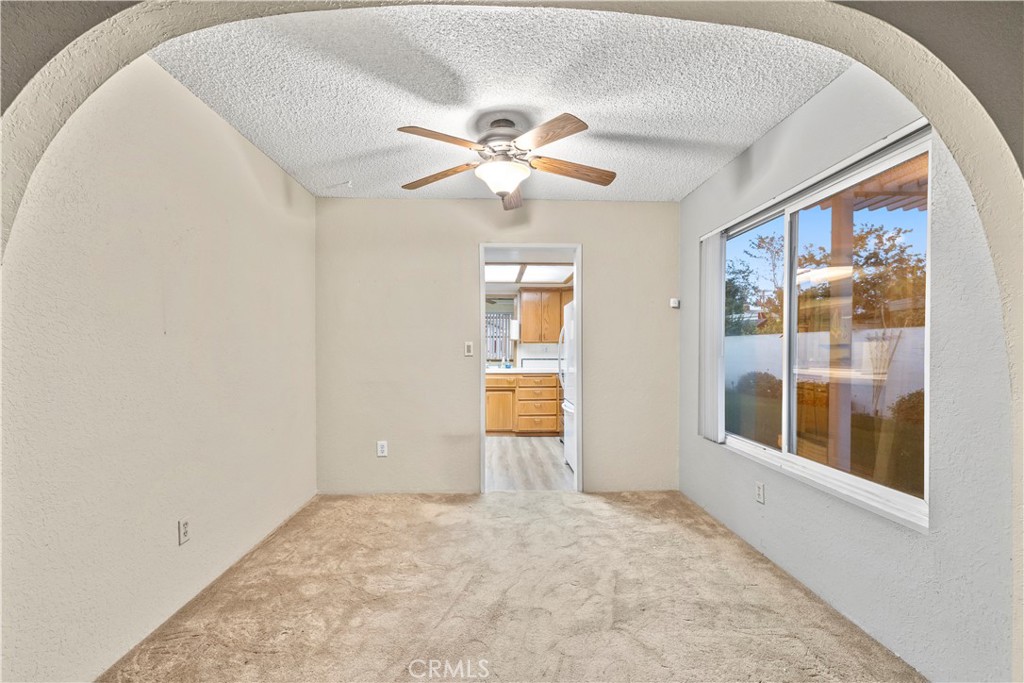 16464 Tullock Street Fontana, CA 92335 - Photo 6 of 43 wooden floor in an empty room with a window