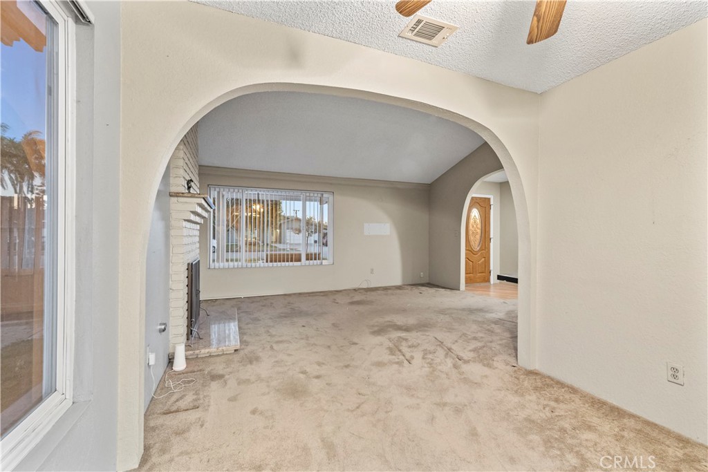 16464 Tullock Street Fontana, CA 92335 - Photo 8 of 43 an empty room with windows