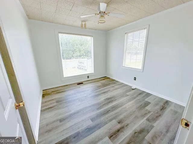a view of an empty room with a window