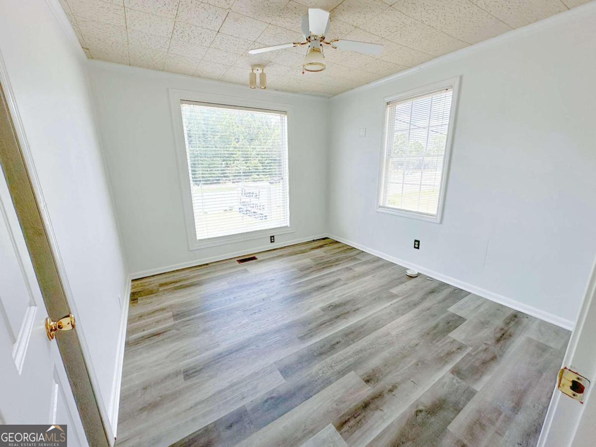 1922 Highway 74 Tyrone, GA 30290 - Photo 4 of 6 a view of an empty room with a window