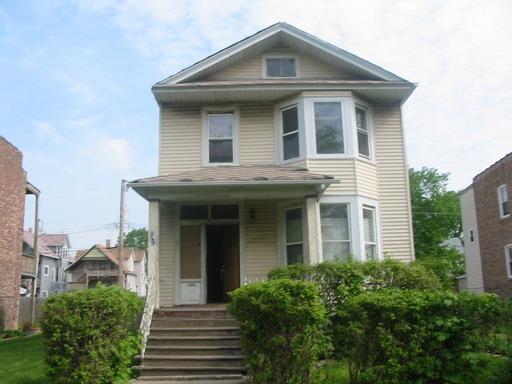 5932 West Rice Street Chicago, IL 60651 - Photo 1 of 1 a front view of a house with garden