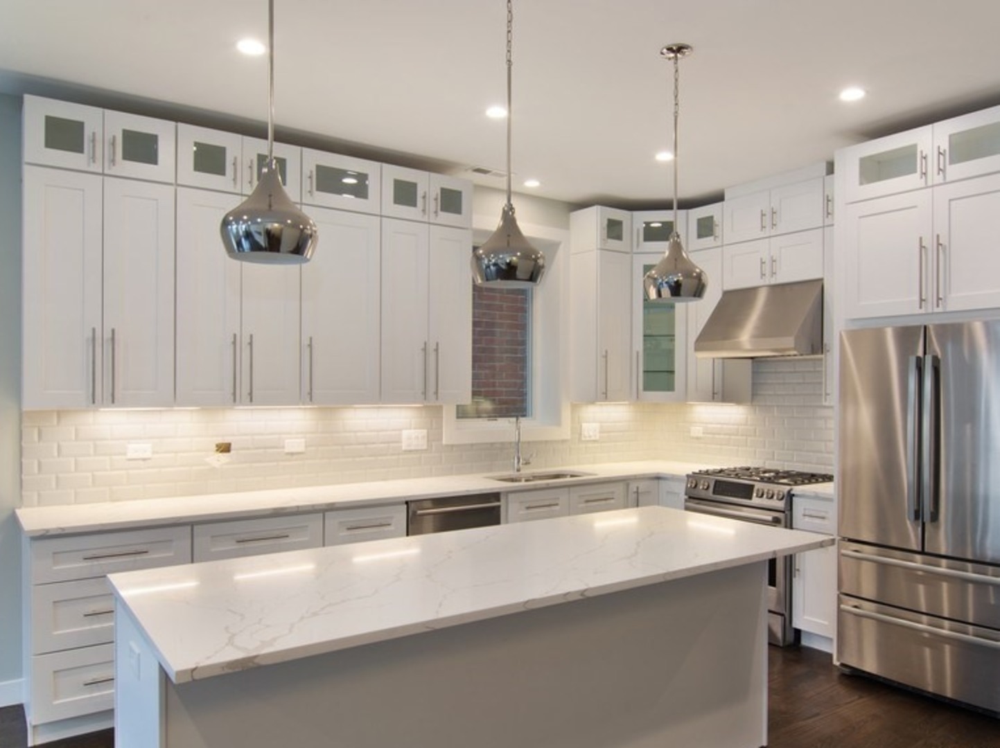 2448-50 North Clybourn Avenue Chicago, IL 60614 - Photo 3 of 10 a kitchen with stainless steel appliances a refrigerator and a sink