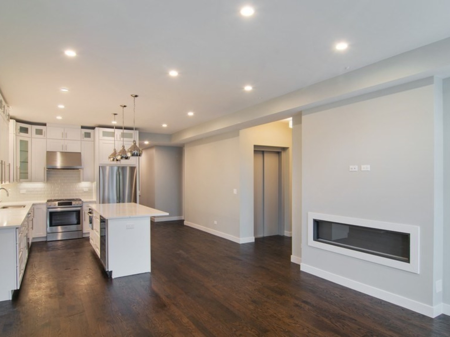 2448-50 North Clybourn Avenue Chicago, IL 60614 - Photo 5 of 10 a view of a kitchen with wooden floor and electronic appliances