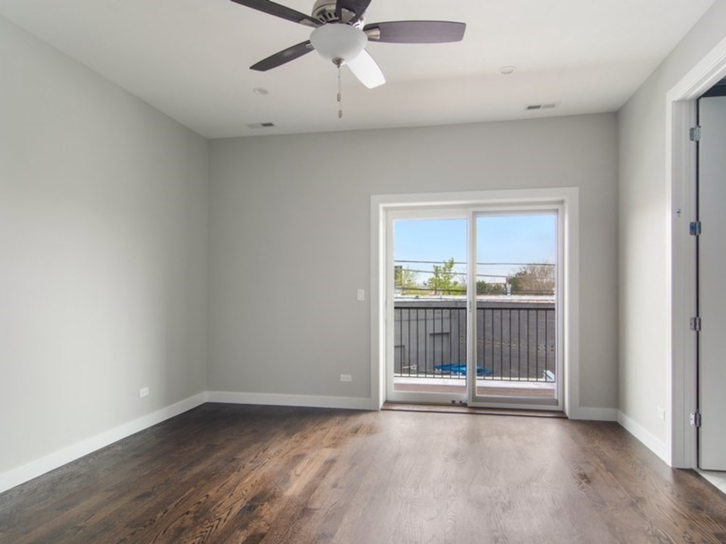 2448-50 North Clybourn Avenue Chicago, IL 60614 - Photo 7 of 10 a view of a livingroom with wooden floor and a ceiling fan