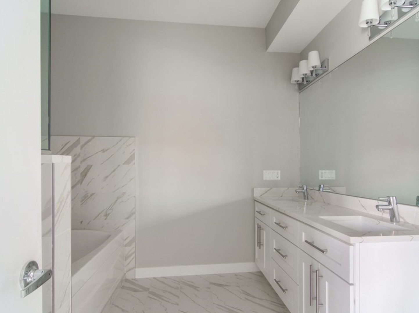 2448-50 North Clybourn Avenue Chicago, IL 60614 - Photo 8 of 10 a bathroom with a granite countertop sink a mirror and shower