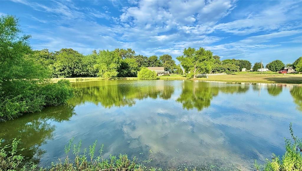 381 Cheyenne Quitman, TX 75783 - Photo 7 of 20 a view of a lake with houses in the back