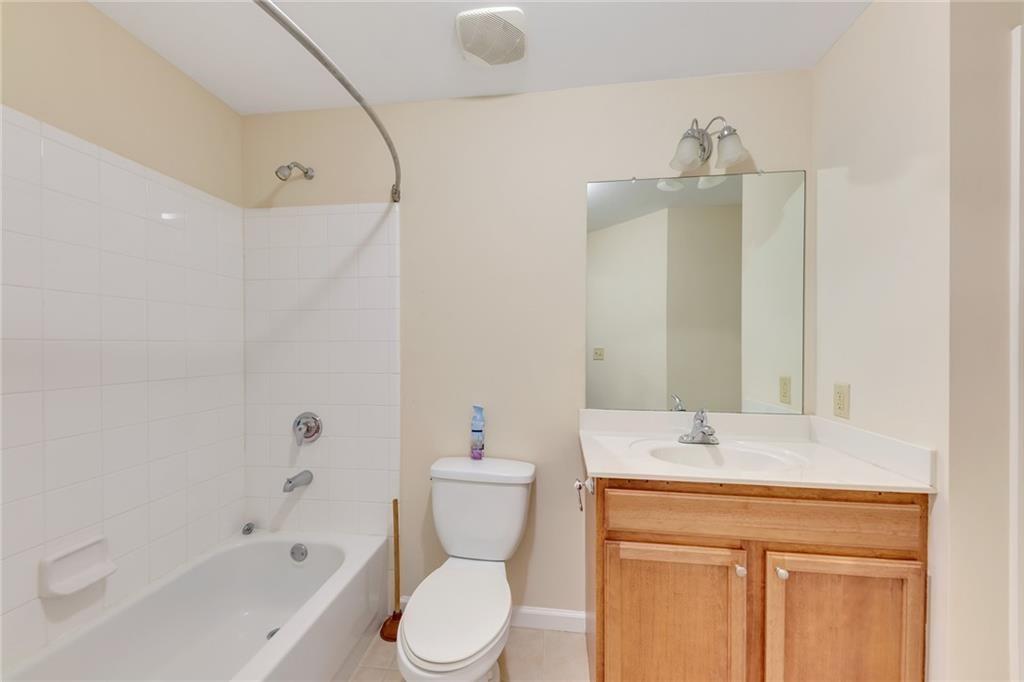3040 Peachtree Road Northwest, Unit 704 Atlanta, GA 30305 - Photo 12 of 16 a bathroom with a sink a toilet and shower