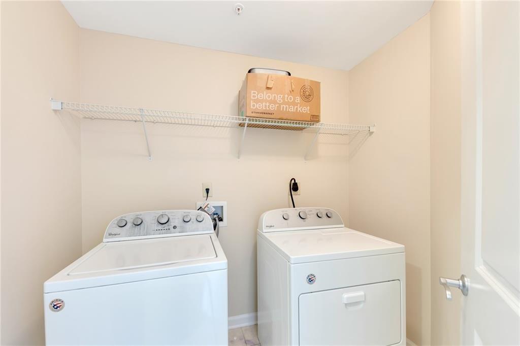 3040 Peachtree Road Northwest, Unit 704 Atlanta, GA 30305 - Photo 13 of 16 a utility room with dryer and washer