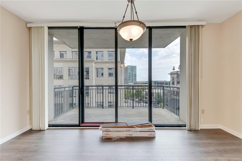 3040 Peachtree Road Northwest, Unit 704 Atlanta, GA 30305 - Photo 3 of 16 a view of room with floor to ceiling window