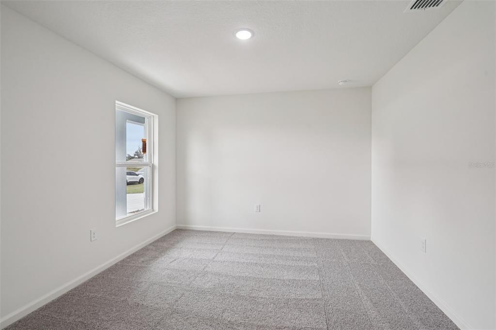 2155 Northwest 23rd Loop Ocala, FL 34475 - Photo 14 of 24 an empty room with windows