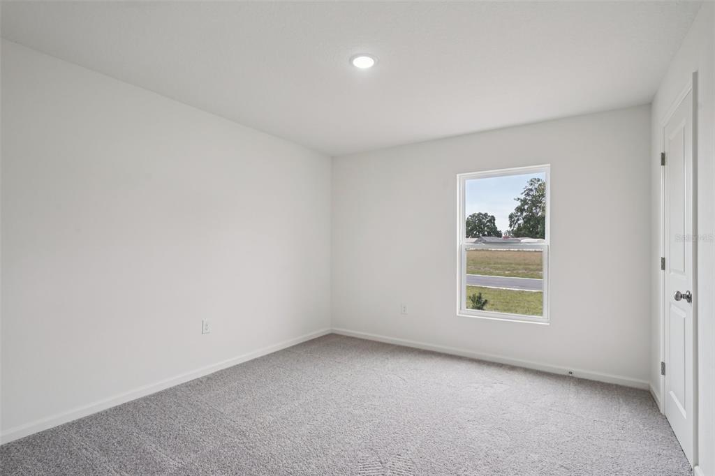 2155 Northwest 23rd Loop Ocala, FL 34475 - Photo 16 of 24 an empty room with a window