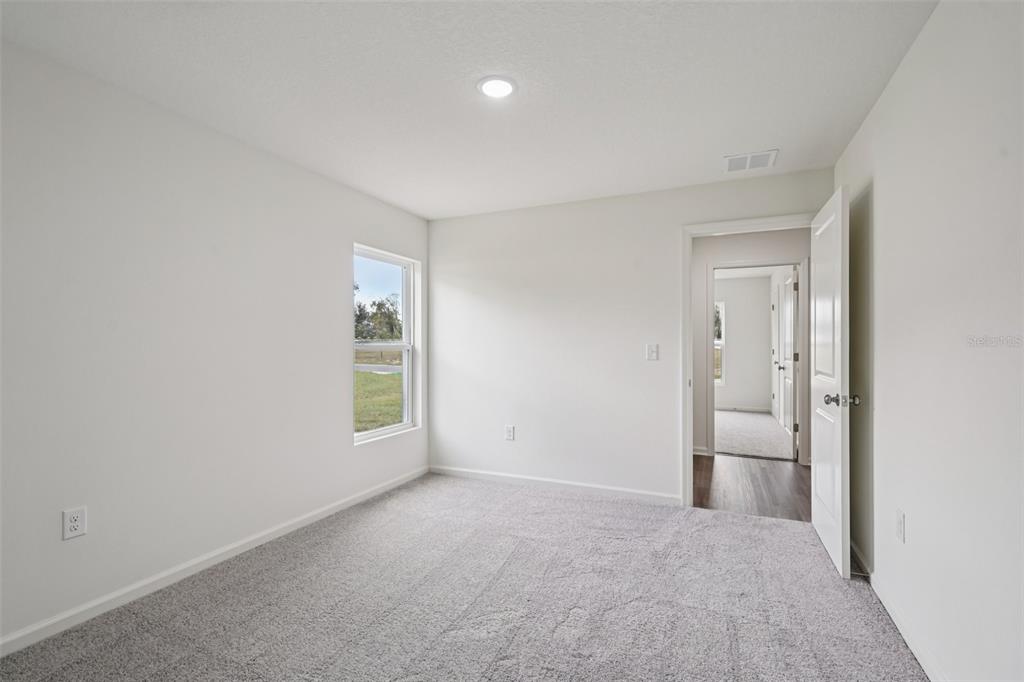 2155 Northwest 23rd Loop Ocala, FL 34475 - Photo 20 of 24 a view of an empty room with a window