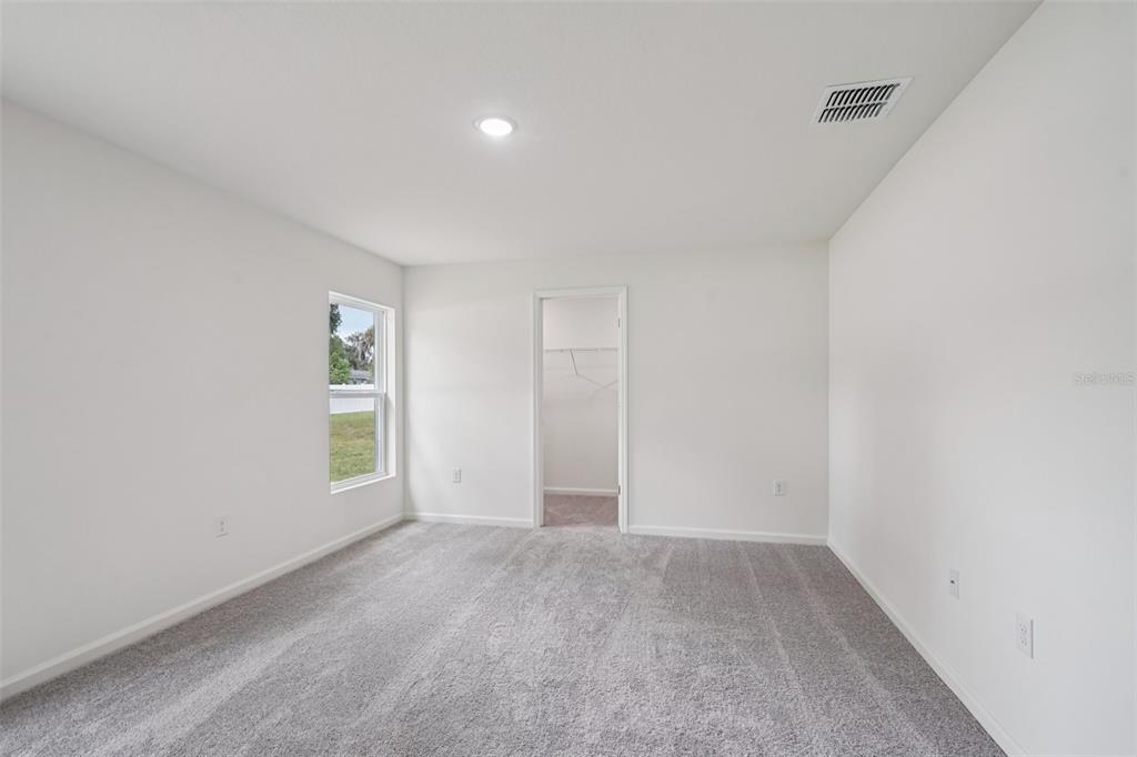 2155 Northwest 23rd Loop Ocala, FL 34475 - Photo 22 of 24 an empty room with windows