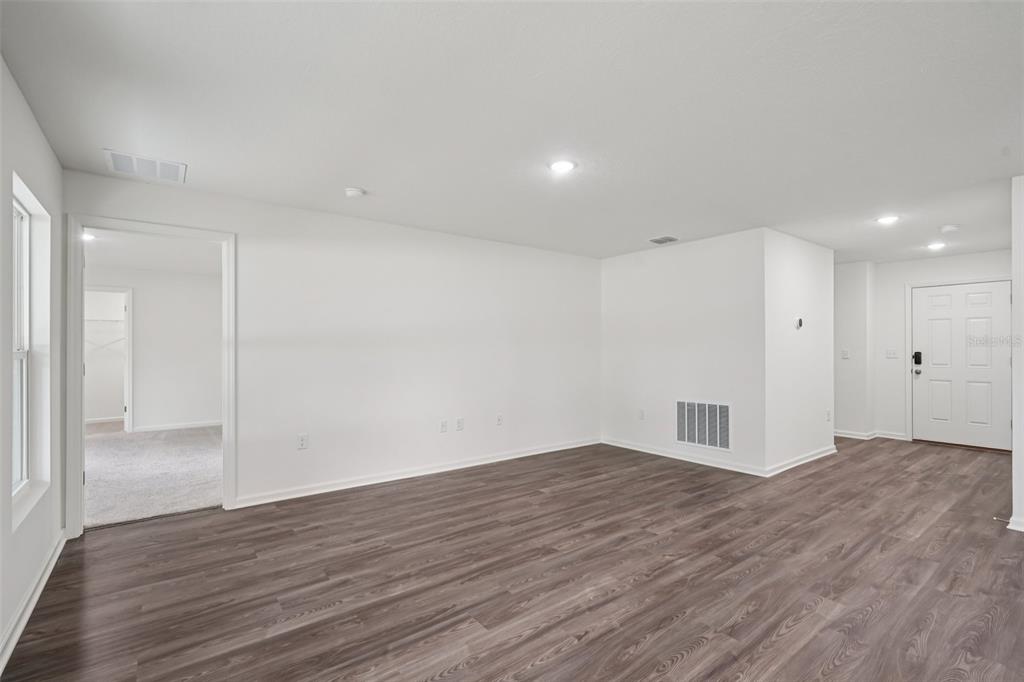 2155 Northwest 23rd Loop Ocala, FL 34475 - Photo 6 of 24 a view of empty room with wooden floor