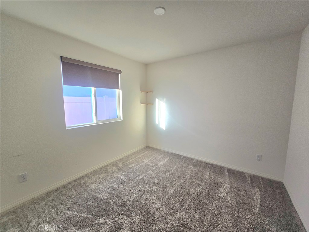 6451 Canyonlands Drive Jurupa Valley, CA 92509 - Photo 11 of 23 an empty room with windows