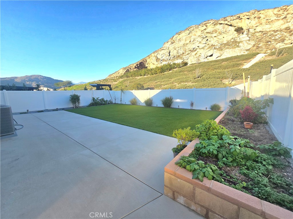 6451 Canyonlands Drive Jurupa Valley, CA 92509 - Photo 20 of 23 a view of a big yard with potted plants